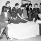 Several of the women who sought compensation from the Radium Dial Company due to radium poisoning gathered around Catherine Donahue in 1938. Image via AP.